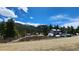 View of a mountain town with homes and a truck at 573 97 Cir, Breckenridge, CO 80424