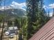 Exterior view of home with mountain backdrop at 573 97 Cir, Breckenridge, CO 80424