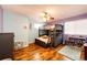 bedroom with bunk beds, light blue and purple walls, and hardwood floors at 5461 E 116Th Ave, Thornton, CO 80233