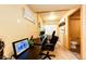 Basement office with a large desk and two chairs at 5461 E 116Th Ave, Thornton, CO 80233