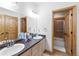 Bathroom with double sinks and a shower/tub combination at 10215 W Wesley Dr, Lakewood, CO 80227