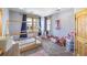 bedroom with a house-shaped bed and plenty of toy storage at 10215 W Wesley Dr, Lakewood, CO 80227