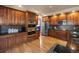 Kitchen with double ovens, stainless steel appliances, and wood cabinets at 10215 W Wesley Dr, Lakewood, CO 80227