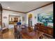 Formal dining room with large table, hardwood floors, and decorative wall art at 10215 W Wesley Dr, Lakewood, CO 80227