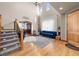 Spacious entryway with hardwood floors, high ceilings, and a view into the living area at 10215 W Wesley Dr, Lakewood, CO 80227