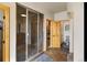 Large bathroom with walk-in shower, toilet, and additional closet space at 10215 W Wesley Dr, Lakewood, CO 80227