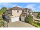 Two-story home with three car garage and driveway at 10215 W Wesley Dr, Lakewood, CO 80227