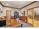 Bright home office features built-in shelving and hardwood floors at 10215 W Wesley Dr, Lakewood, CO 80227