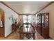 Bright dining room featuring a large table and hardwood floors at 10215 W Wesley Dr, Lakewood, CO 80227