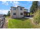 Two-story home with covered patio and stone accents at 10215 W Wesley Dr, Lakewood, CO 80227