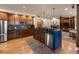 Kitchen boasts a large island, stainless steel appliances, and dark wood cabinetry at 10215 W Wesley Dr, Lakewood, CO 80227