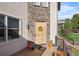 Elegant front door entrance with stone details and deck at 10215 W Wesley Dr, Lakewood, CO 80227