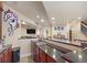 Basement wet bar with sink and dark wood cabinets at 10215 W Wesley Dr, Lakewood, CO 80227