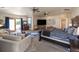 Luxurious main bedroom featuring a king bed, sitting area, and private access to balcony at 10215 W Wesley Dr, Lakewood, CO 80227