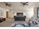 Spacious main bedroom with a king-size bed, sitting area, and ceiling fans at 10215 W Wesley Dr, Lakewood, CO 80227