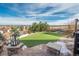 Landscaped backyard with artificial turf and stone features at 22435 Boundstone Dr, Parker, CO 80138