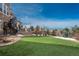 Artificial turf lawn and tiered patio with mountain views at 22435 Boundstone Dr, Parker, CO 80138
