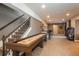 Basement with shuffleboard table, bar area, and game machines at 22435 Boundstone Dr, Parker, CO 80138