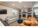 Finished basement with fireplace, sitting area, and game equipment at 22435 Boundstone Dr, Parker, CO 80138