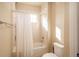 Simple bathroom with shower/tub combo and updated fixtures at 22435 Boundstone Dr, Parker, CO 80138