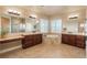 Elegant bathroom with double vanities, soaking tub, and walk-in shower at 22435 Boundstone Dr, Parker, CO 80138