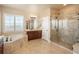 Spa-like bathroom featuring a large shower and a corner bathtub at 22435 Boundstone Dr, Parker, CO 80138