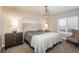 Spacious bedroom with plush bedding and ample natural light at 22435 Boundstone Dr, Parker, CO 80138