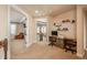 Upstairs hallway with built-in workspace and views to below at 22435 Boundstone Dr, Parker, CO 80138