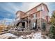 Exterior of house showcasing stone, wood, and deck at 22435 Boundstone Dr, Parker, CO 80138