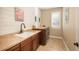 Laundry room with built-in cabinets and a window for natural light at 22435 Boundstone Dr, Parker, CO 80138