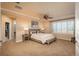 Spacious main bedroom with a ceiling fan, walk-in closet, and ensuite bathroom at 22435 Boundstone Dr, Parker, CO 80138