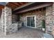 Covered outdoor kitchen area with built-in grill at 22435 Boundstone Dr, Parker, CO 80138