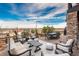 Spacious patio with seating, dining, and string lights at 22435 Boundstone Dr, Parker, CO 80138