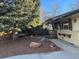 House exterior showcasing a side view with mature trees and a walkway at 1750 S Ironton St, Aurora, CO 80012