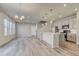 Modern kitchen with white cabinets, island, and stainless steel appliances at 3356 Ireland Moss St, Castle Rock, CO 80109