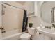 Updated bathroom with a tub shower combo, vanity, and tile floors at 13888 Ptarmigan Dr, Broomfield, CO 80020