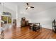 Bright dining area with hardwood floors, a table, and access to a deck at 9451 Garden Ct, Highlands Ranch, CO 80126