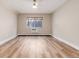 Well-lit bedroom with laminate flooring and window at 3144 S Wheeling Way # 107, Aurora, CO 80014