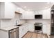 Modern kitchen with stainless steel appliances and white cabinets at 3144 S Wheeling Way # 107, Aurora, CO 80014