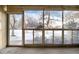 Sunroom with multiple windows overlooking a park-like setting at 3144 S Wheeling Way # 107, Aurora, CO 80014