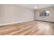 Large bedroom with ceiling fan, window, and laminate flooring at 3144 S Wheeling Way # 107, Aurora, CO 80014