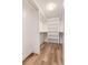 Bright walk-in closet with double hanging rods and shelving at 3144 S Wheeling Way # 107, Aurora, CO 80014