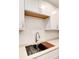 Modern kitchen sink with a wooden cutting board at 3144 S Wheeling Way # 107, Aurora, CO 80014