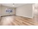 Spacious bedroom with laminate flooring and large window at 3144 S Wheeling Way # 107, Aurora, CO 80014