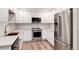 Modern kitchen with stainless steel appliances and white cabinets at 3144 S Wheeling Way # 107, Aurora, CO 80014