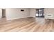 Spacious living area with laminate wood flooring and sliding door access at 3144 S Wheeling Way # 107, Aurora, CO 80014