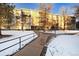 Apartment building exterior with snow covered landscaping at 3144 S Wheeling Way # 107, Aurora, CO 80014