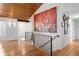 Modern entryway with hardwood floors and a wood accent ceiling at 7341 E Long Ave, Centennial, CO 80112