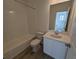 Clean bathroom with single vanity and a shower/tub combo at 8491 Eagle River St, Littleton, CO 80125