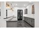 Basement bar with gray cabinets and a marble backsplash at 457 S Vine St, Denver, CO 80209